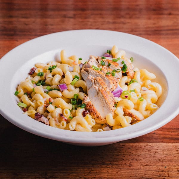 Unwined Kitchen & Bar's New American macaroni and cheese with grilled chicken, bacon, and chives.